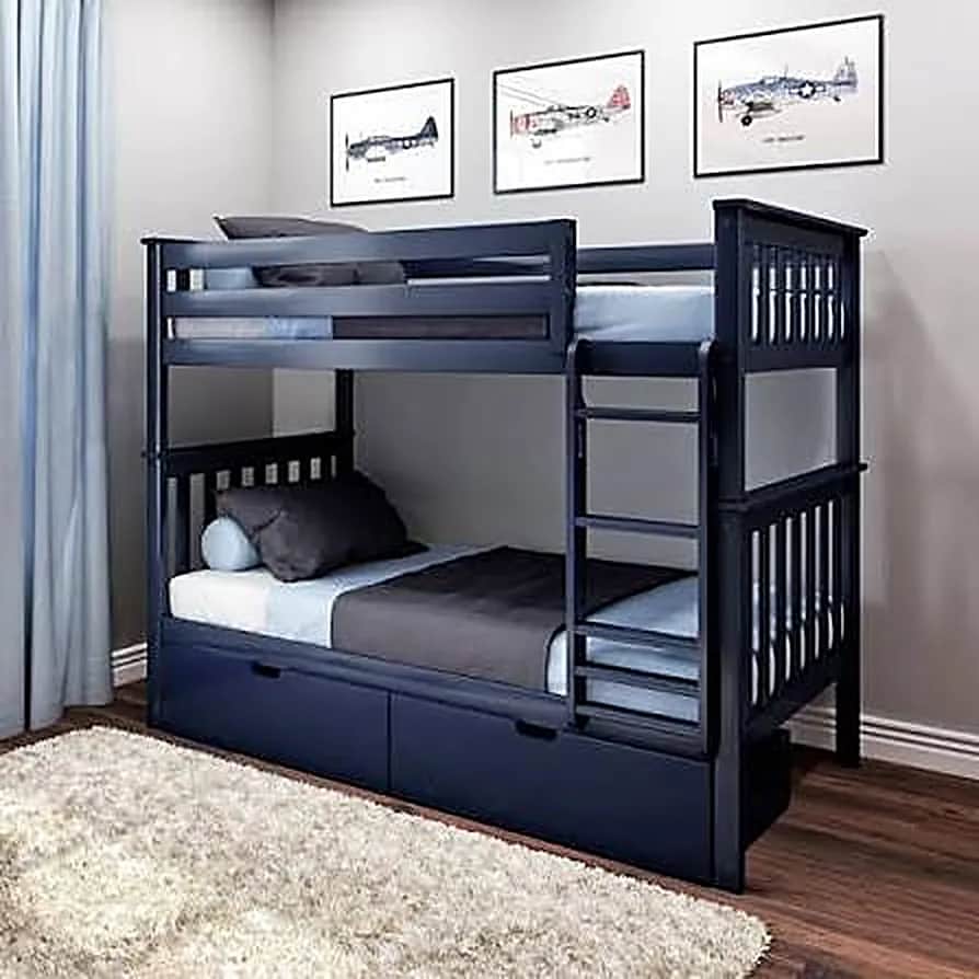 Navy bunk beds with made-up linen and under-bed storage in a C4 bedroom