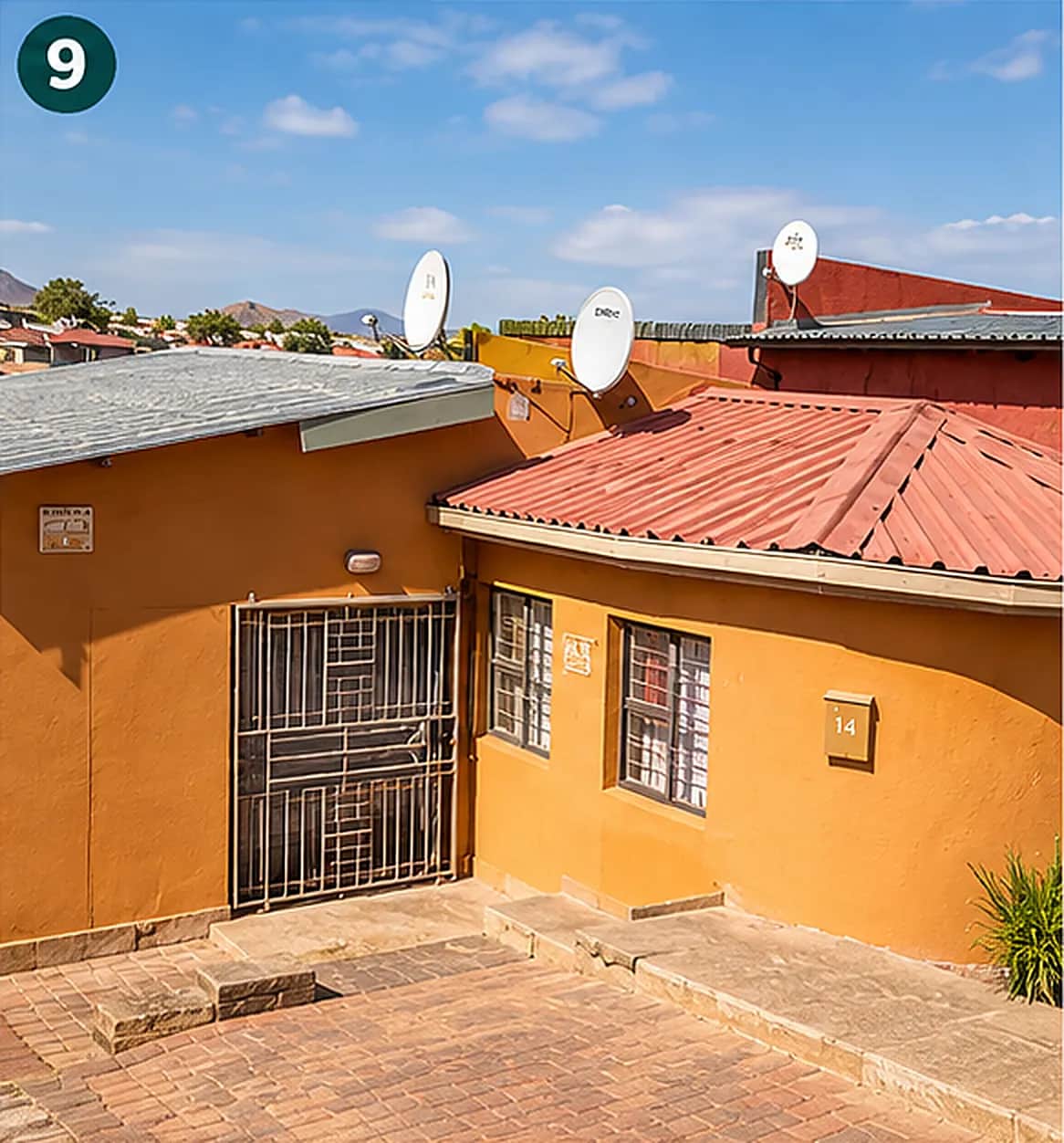 Clear blue sky over the C4 roof and its satellite dishes